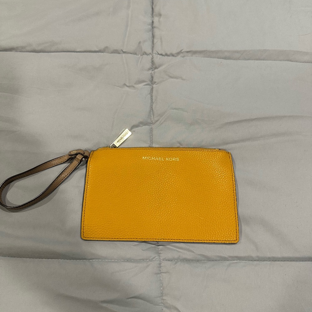 MK (Michael Kors) wristlet. Mustard yellow. Great color for fall.